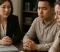Couple consults attorney during divorce case review, discussing settlement options and documents on table today