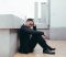 young-asian-depressed-man-sitting-on-outdoors-stre-2023-11-27-04-55-35-utc