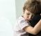 Young child hugging an adult, reflecting emotional strain, insecurity, and the impact of family conflict